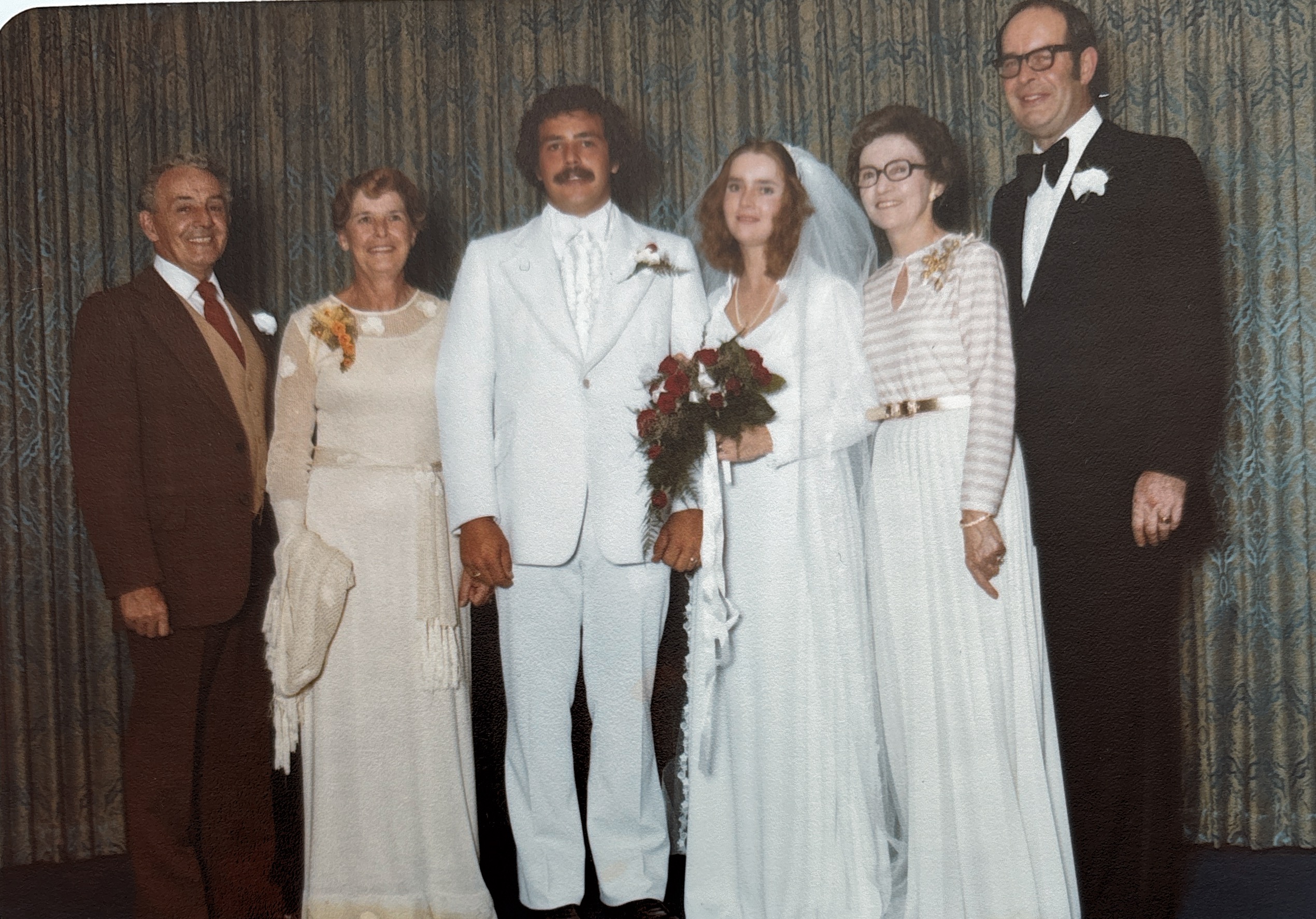 Joan and Stewart at their wedding with family